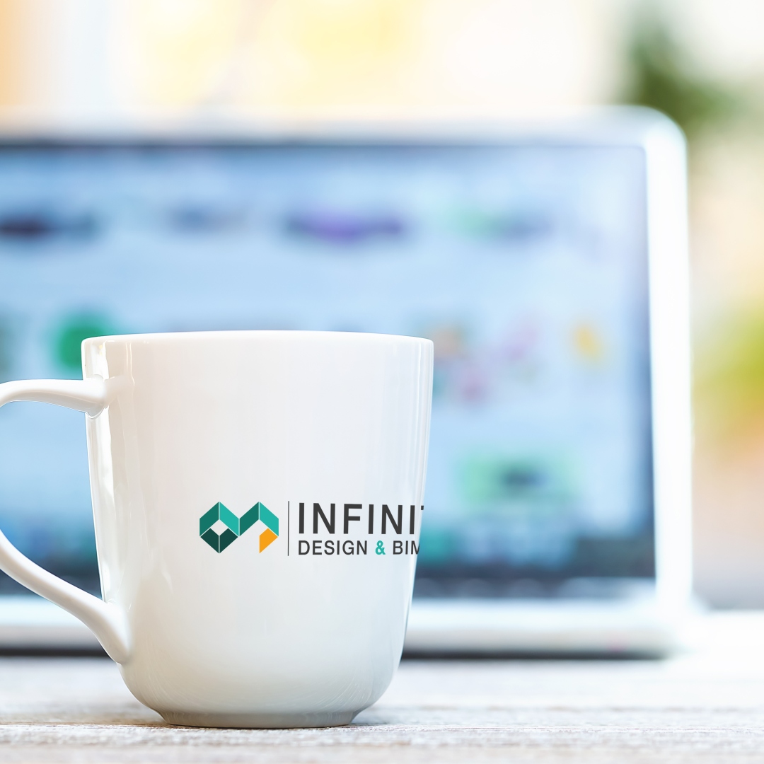 Coffee mug with laptop computer on a bright background